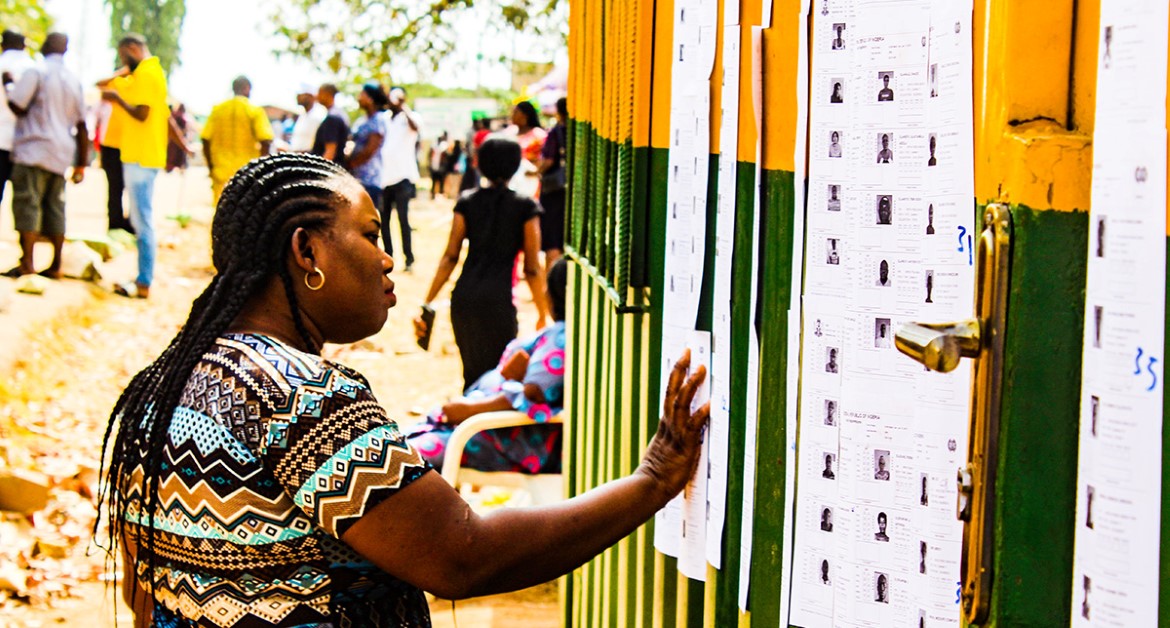 A voter checks for her name on the voter's list.