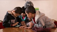 Al-Sheikh siblings play the EduApp4Syria game Antura