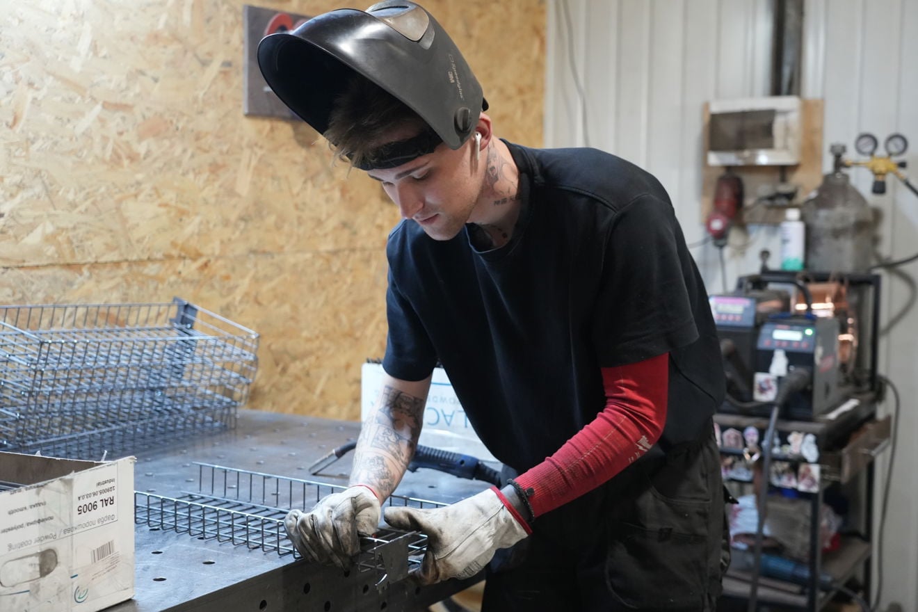 Employees work inside the MARKQUEN Company production facility.