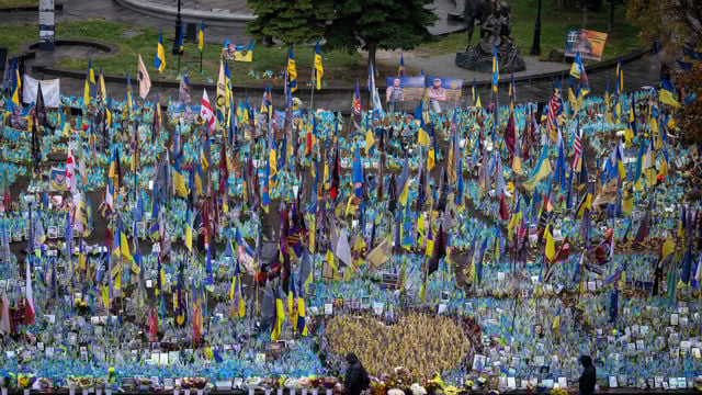 eople walk past the memorial to fallen soldiers in Independence Square in Kyiv, Ukraine, Friday, Nov. 15, 2024.