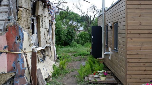 Locally produced prefabricated houses that can be placed on the family's property are used by UNHCR to support vulnerable families whose homes have been destroyed.